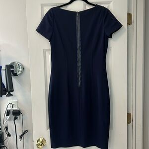 Elie Tahari, knee length, navy dress with a silk zipper detail